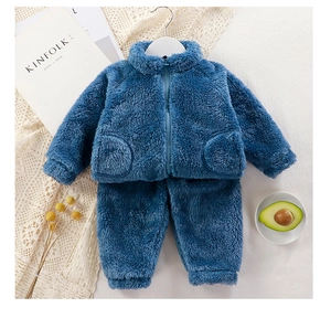 Detail of dark blue plush toddler two-piece set with zipper jacket and ribbed cuffs