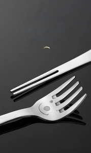 Close-up of a 304 stainless steel fork featuring a smiley face and polished round teeth