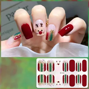 Detail view of Christmas gel nail stickers with reindeer and glitter patterns, model CS-423