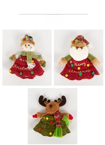 Detailed close-up of Snowman, Santa, and Reindeer plush Christmas fabric decorations