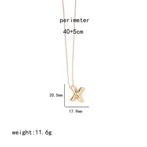 Detail view of a gold-plated letter X pendant with size measurements and chain length