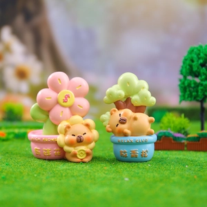Set of two cute resin figurines featuring a lion with a coin and a sleeping bear on grass