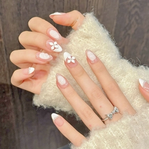 Pink and white french manicure press-on nails with 3D flowers, pearls and bow ring