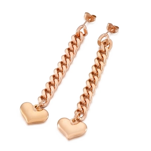 Rose gold stainless steel Cuban chain drop earrings with heart pendant on white background