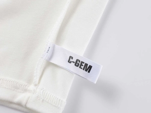 Detailed close-up of C-GEM brand label on white modal sports T-shirt stitching