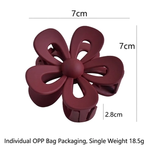 Matte burgundy flower hair claw clip with dimensions 7x7cm shown on a white background