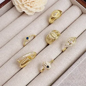 18K gold plated evil eye and hamsa hand rings set with blue cubic zirconia
