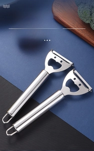 Close-up of stainless steel multifunctional peeler with bottle opener and hanging loop