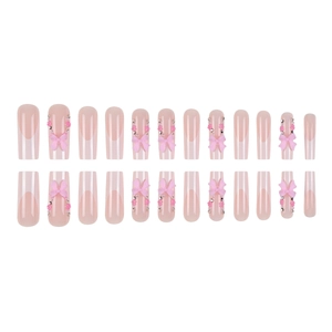Pink French long press-on nails set with 3D bows, flowers, and rhinestone accents