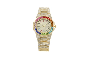 Detailed close-up of a gold luxury watch featuring a rainbow crystal bezel and rhinestone band