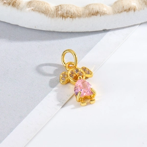Detailed view of a gold girl charm with a pink teardrop stone and sparkling accents