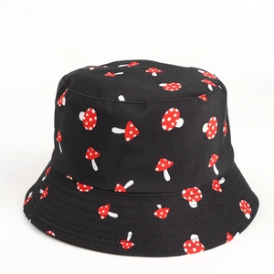 Detail of black cotton bucket hat featuring red and white mushroom pattern print