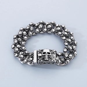 Macro detail of gothic skull clasp and heavy silver chain in vintage punk metal style