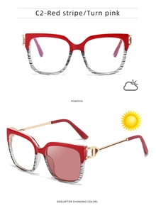 Cat eye glasses frame with red black stripes and gold metal temples in macro detail