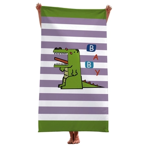 Detail of soft striped microfiber towel with a green cartoon dinosaur and BABY text print