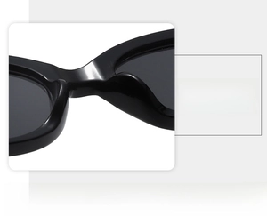Detail shot of the integrated nose pad on black cat-eye sunglasses for lightweight comfort