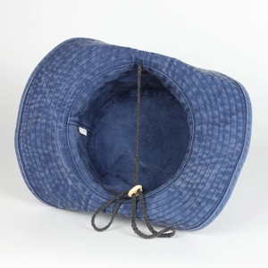 Detail of navy washed cotton sun hat featuring interior stitching and adjustable chin cord