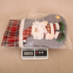 Lightweight 63g Christmas stocking featuring a 3D Santa Claus and plaid cuff detail