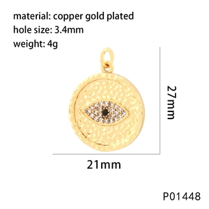 Macro shot of 21x27mm gold-plated copper Evil Eye charm with crystal micro-inlay details