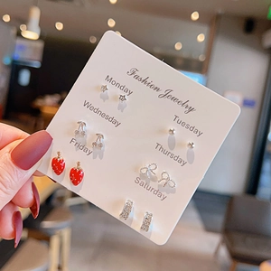 Detailed view of 6-pair set featuring cherry, strawberry, and bow studs on a week card