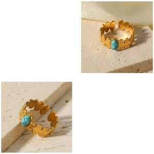 Detail of 18K gold-plated adjustable ring with turquoise stone and hollow leaf pattern