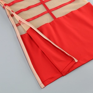 Close-up of red mesh patchwork dress with side zipper and decorative straps