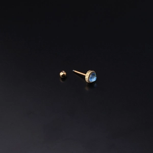Gold stud earring with teardrop blue moonstone and screw ball back on black background