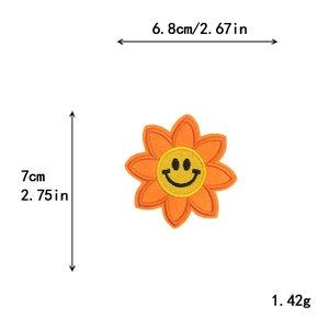 Smiling sunflower embroidery patch in orange and yellow with size 6.8x7cm dimensions