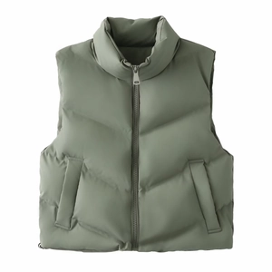 Detail view of puffer vest with stand collar, zipper closure and soft matte texture