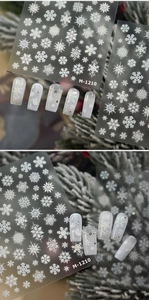 Macro detail of M-1210 white snowflake nail stickers with 3D embossed texture