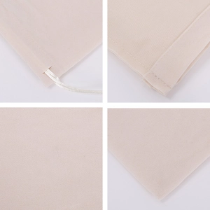 Detail view of beige drawstring jewelry pouch showing fabric texture and stitching