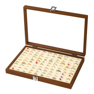 Walnut wood jewelry box with glass lid and velvet slots for ring storage