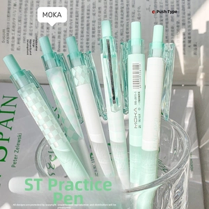 Close-up of mint green and white ST push-type gel pens in a glass for study