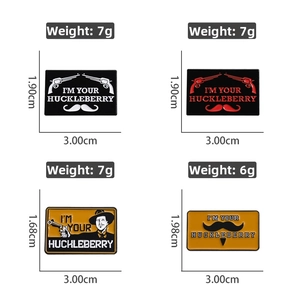 Detail view of four western cowboy enamel pins showing pistol and mustache designs