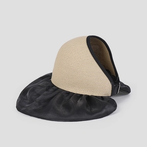 Detail view of the contrast color sun visor with straw weave top and black brim