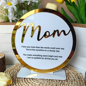 Detailed view of circular Mother's Day acrylic plaque with gold rim and Mom poem engraving