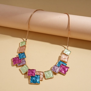 Detail of colorful geometric square pendant necklace with multi-color enamel inlay
