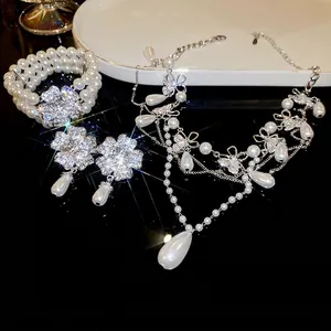 Elegant floral diamond necklace set with water drop pearl pendants and sparkling crystals