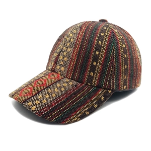 Detailed view of woven tribal geometric patterns on bohemian style baseball cap fabric
