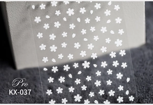 Macro shot of white cherry blossom 5D nail stickers on transparent PET film
