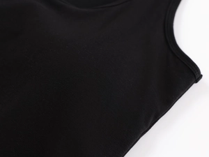 Macro detail of high-quality stitching and dense knit fabric on black athletic tank top