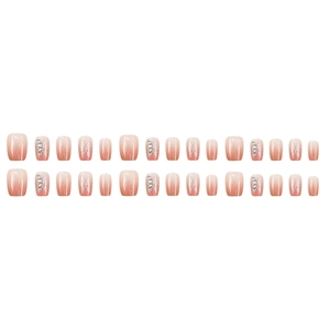 Pink ombre press-on nails with silver butterfly accents and rhinestones in 24 piece set