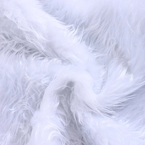 Plush white faux fur Christmas tree skirt with thick long hair and soft texture