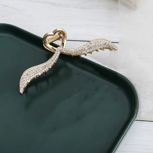 Elegant gold metal angel wing hair claw clip with rhinestones and heart design