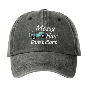 Washed dark gray baseball cap with Messy Hair Don't Care text and blue off-road car icon