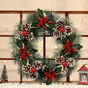 Christmas pine needle wreath with pine cones and red berries on a cozy window background