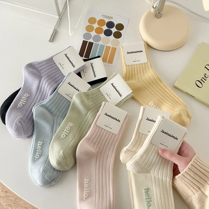 Colorful pastel combed cotton mid-calf socks with hello embroidery on ribbed knit texture
