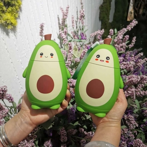 Close-up of cute avocado double-walled glass cups with smiling faces and green lanyard