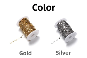 Detail of 9mm gold and silver star-shaped stainless steel jewelry chains on spools