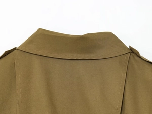 Detail of khaki twill jacket collar and epaulets with precise stitching on premium fabric